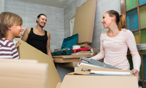 Furniture collection team handling a sofa pick-up in Finchley street setting