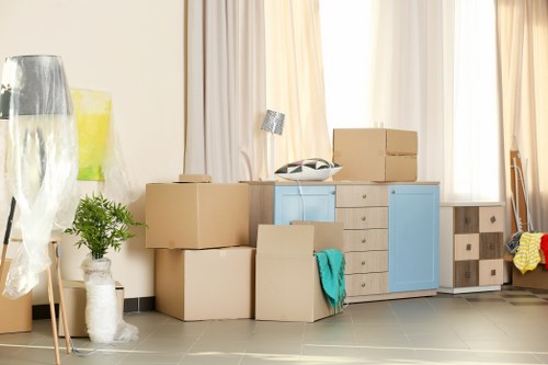 Professional packers handling fragile household items in Finchley