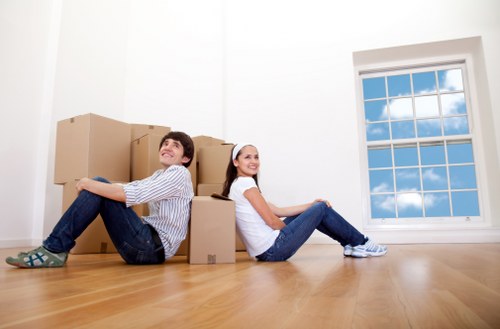 Packed boxes and moving equipment ready for a local move in Finchley