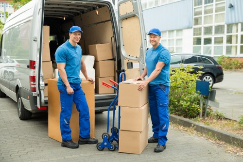 Careful loading of household items into a removal van