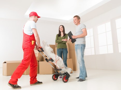 Local moving team handling boxes and furniture in Finchley