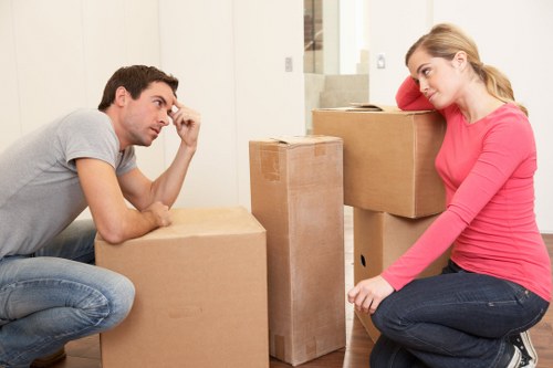 Packed moving boxes and furniture ready for transport in North London