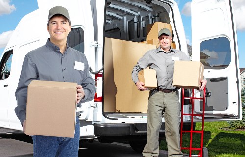 Loading furniture into a removals van in Finchley