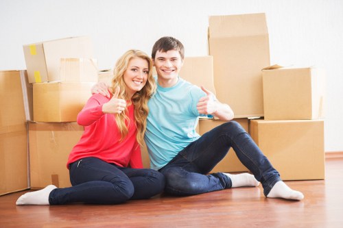 Professional movers preparing boxes for transport in Finchley